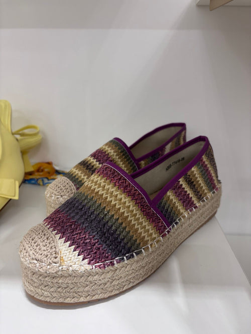Woven espadrilla with purple, khaki, and beige stripes and braided jute platform sole.