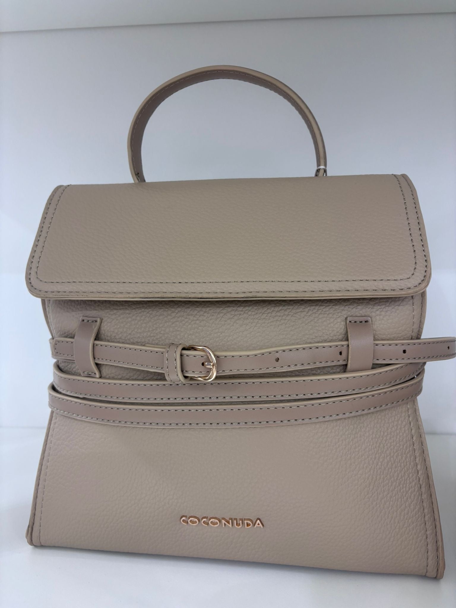 Khaki sporty chic handbag with top handle and adjustable front buckle strap.