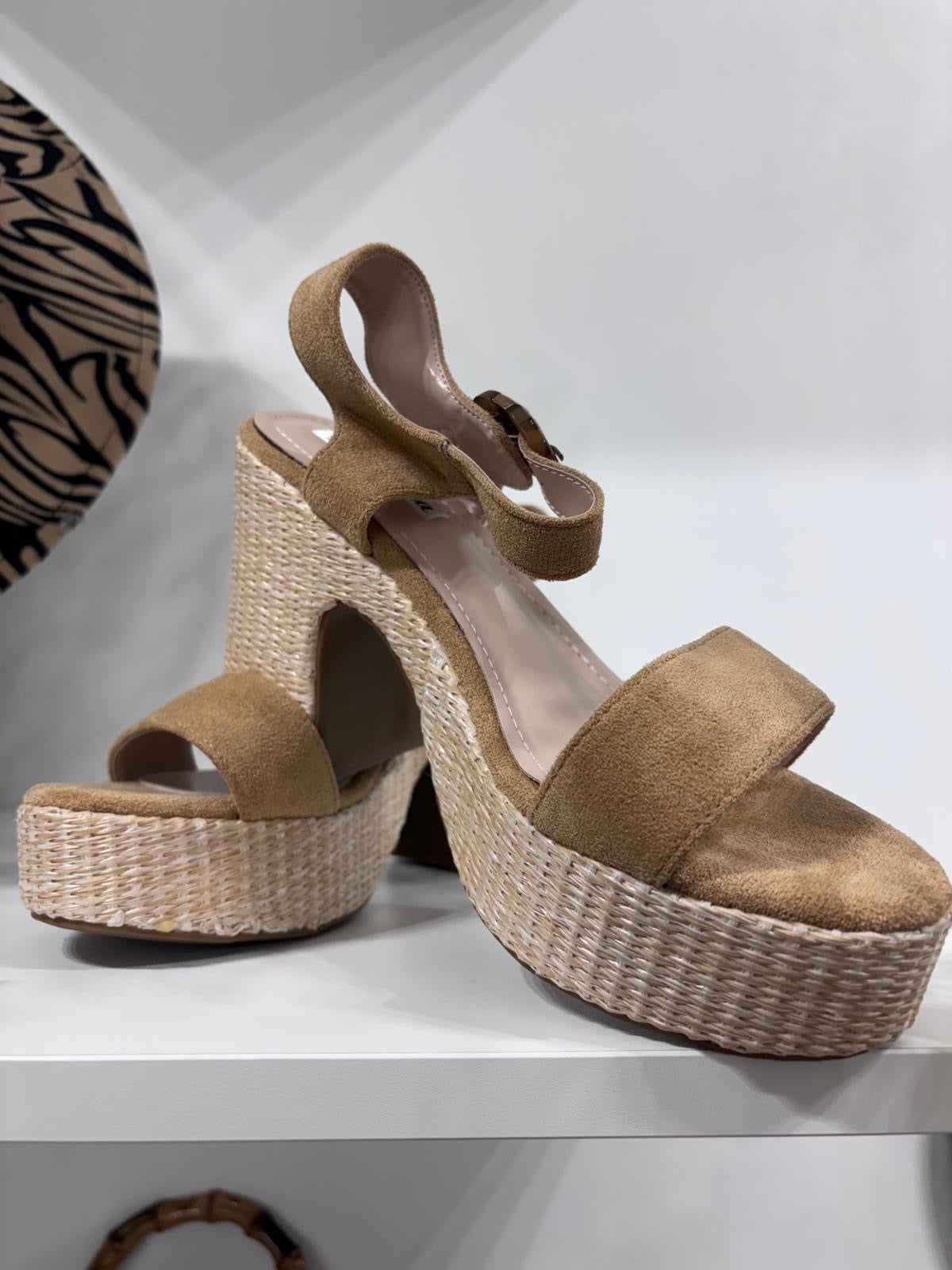 Beige suede platform espadrille sandals with adjustable ankle strap and woven jute heel.