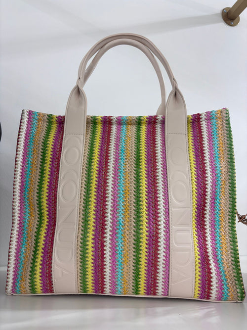 Multicolor striped woven tote bag with beige leather handles and trim.
